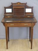 A 19thC rosewood inlaid bonheur du jour, the top having tambour centre cupboard flanked by drawers,