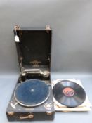 A Columbia portable wind up gramophone with Cheltenham retailer's plaque to front and a quantity of