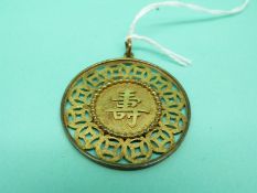 A Chinese yellow metal pendant marked 14k in the form of a Chinese character, weight 7.