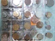 A Magpie collector's album containing an amateur collection of largely overseas coinage,