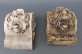 A near pair of grotesque salt glaze pottery garden wall mounted mask plaques by Lipscombe and Co.