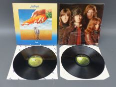 Two Bad Finger albums Straight Up on UK Apple and Ass on USA Apple,