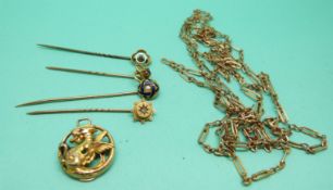 Two 9ct gold stick pins, one set with a ruby and one a garnet,