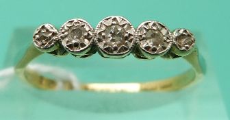 An 18ct gold ring set with five diamonds in a platinum setting (Size Q)