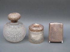 An Edward VII hallmarked silver topped hobnail cut globe shaped glass dressing table bottle,