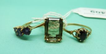 Three 9ct gold rings, one set with amethyst,