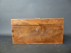 A Georgian flame mahogany tea caddy with banded inlaid decoration with internal fittings comprising