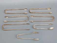 Five pairs of Georgian hallmarked silver sugar tongs including bright cut examples,
