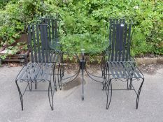 A metal and glass garden table, diameter 86cm,