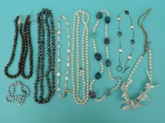 Ten pearl necklaces including four large single strands of freshwater pearls,