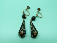 A pair of Victorian tortoiseshell pique earrings with gold inlaid decoration.