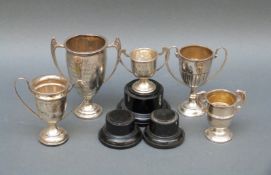 Five small or miniature hallmarked silver twin handled trophy cups, largest height 9cm,