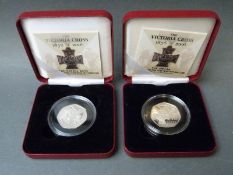 Two Victoria Cross cased silver 2006 commemorative fifty pence coins The Award and Heroic Acts,