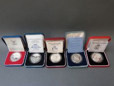 Five various cased and certificated Royal commemorative silver proof crowns