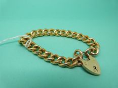 A 9ct gold curb link bracelet with chased detail, weight 17.
