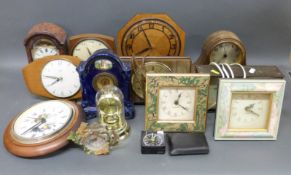 A collection of fifteen various clocks to include Smiths, Metamac, ceramic cased c1910 example,