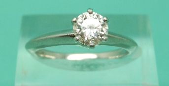 A platinum Tiffany & Co ring set with a modern round brilliant cut diamond measuring 0.
