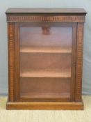 A 19th Century rosewood pier cabinet with specimen wood crossbanding,