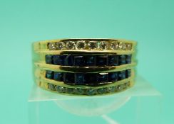 An 18ct gold diamond and sapphire ring (Size V)