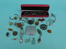 A silver necklace set with paste,
