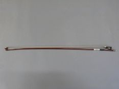 A silver mounted violin bow,