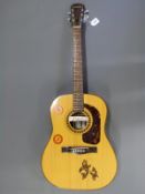 Giannini Brazilian acoustic guitar with six steel strings on individual tuning pegs and retro