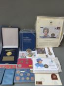 A collection of coin commemoratives and Whitman folders, pennies,