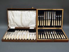 A mahogany cased twelve place setting dessert service with hallmarked silver collars and another