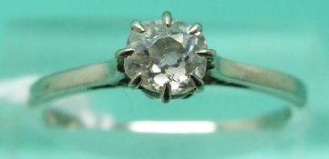 A white metal ring marked 18ct set with an old cut diamond of approx 0.
