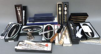 Approximately 35 novelty and commemorative letter openers including an example formed as a sword