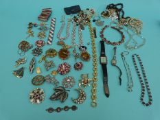 A collection of brooches, an agate necklace,