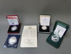 Four various silver commemorative coins some cased,