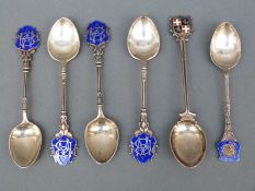 Six various hallmarked silver and enamel teaspoons including an armorial example,