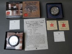 Two Canadian Royal Mint silver dollars in original boxes with certificates,