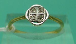 An 18ct gold ring set with diamonds in a platinum setting (Size P)