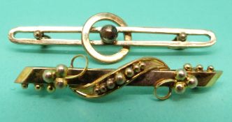 A Victorian yellow metal brooch and an Edwardian example
