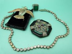 A silver ring,Trifari brooch in the form of a hummingbird,