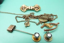 Two 9ct gold chains, 9ct gold cross, 9ct gold brooch in the form of a wishbone and kookaburra etc,