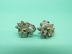 A pair of 9ct gold earrings set with diamonds