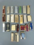 A collection of approximately 20 cigarette lighters to include Superkings,