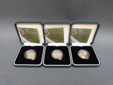 Three Discovery of DNA cased silver proof £2 coins with certificates