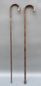 Two hallmarked silver mounted bamboo walking canes including one modelled as a horse's hoof with