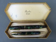 A boxed Burnham fountain pen and propelling pencil set,