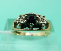 A 9ct gold ring set with a sapphire and diamonds (Size K)