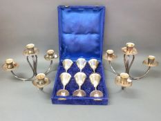 A pair of retro Danish or similar silver plated candelabra and a boxed set of six silver plated