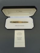 Omas Ogiva fountain pen with 18k white gold medium nib and clear body showing workings,