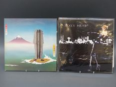 Approximately 100 Rock/Pop LPs most appear to be in ex condition and kept in protective plastic