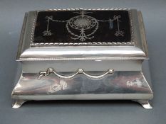 An Edward VII hallmarked silver and piquet tortoiseshell dressing table casket or box raised on