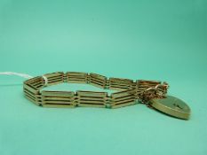 A 9ct gold gate bracelet with padlock clasp, weight 18.