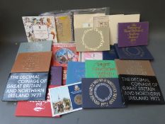 A collection of commemorative UK brilliant uncirculated coin sets, 70s,